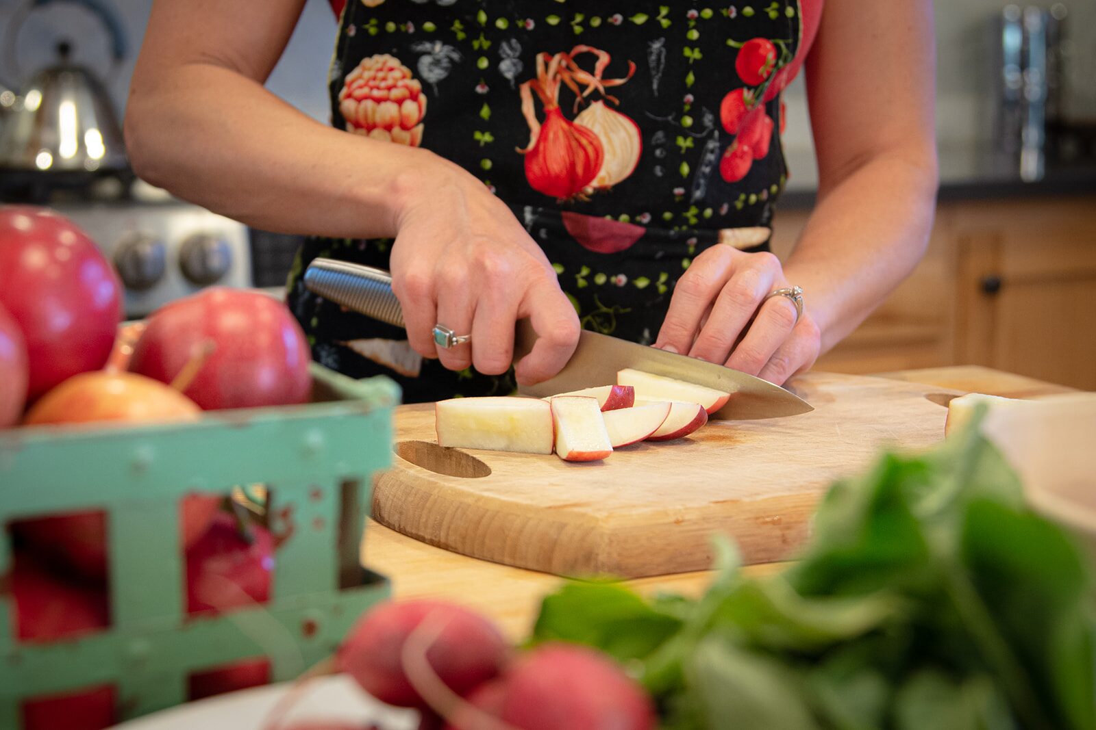 Cutting an apple on a wooden board